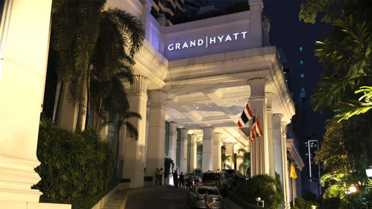 A man walks outside the​ Grand Hyatt ‌Erawan ‍Hotel in Bangkok, Thailand.