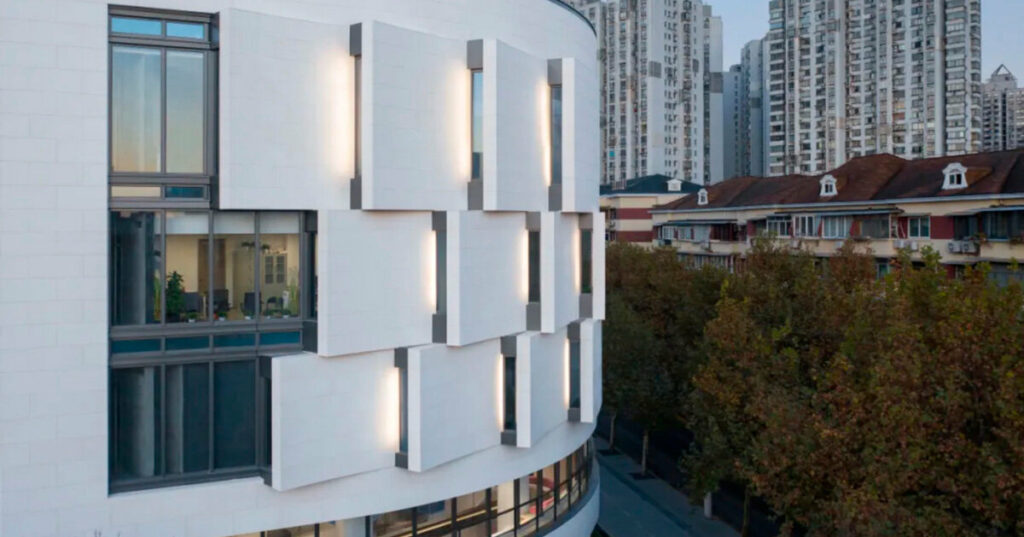 staggered arc facade wraps jiangpu community culture and sports center