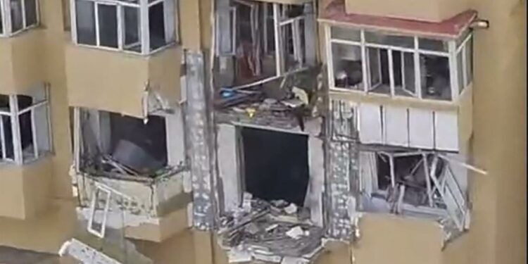 An explosion at an apartment building in northeastern China kills 1 and injures 3