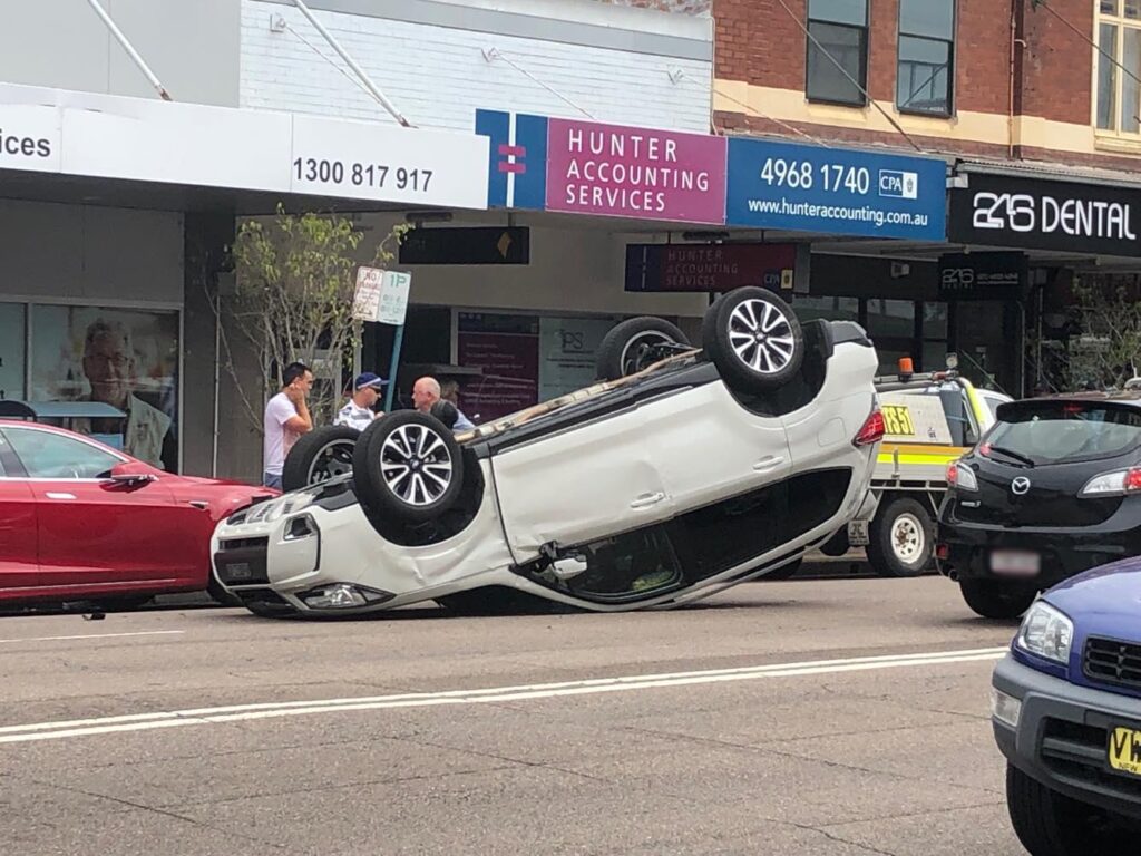 Car flips near popular Sydney beach – News.com.au