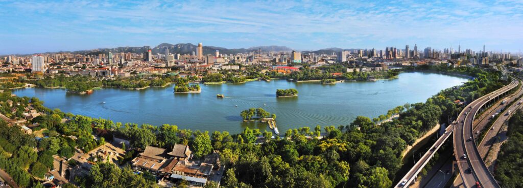 Night view of Daming Lake and city viaduct skyline in Jinan, Shandong, China – Mining.com