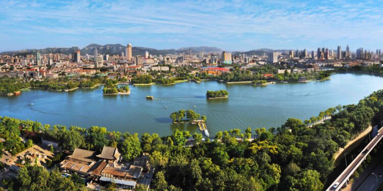 Night view of Daming Lake and city viaduct skyline in Jinan, Shandong, China – Mining.com