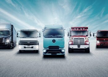 Trucks queue next to containers at the Myanmar Industrial Port along the Yangon River in Yangon on Friday. PHOTO: AFP – daily-sun.com