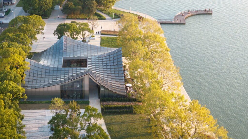 BIG completes glass-tiled pavilion overlooking lake in Suzhou – Dezeen