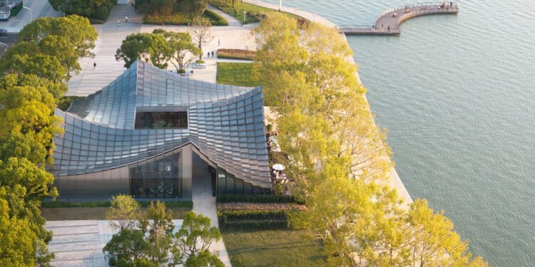 BIG completes glass-tiled pavilion overlooking lake in Suzhou – Dezeen