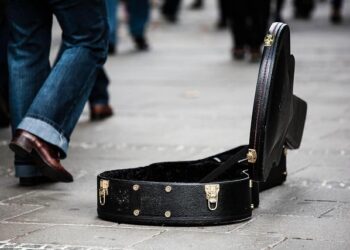 Russian street musician is jailed for 13 days after she played banned song – Reuters