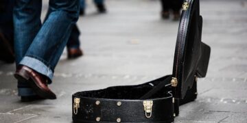 Russian street musician is jailed for 13 days after she played banned song – Reuters