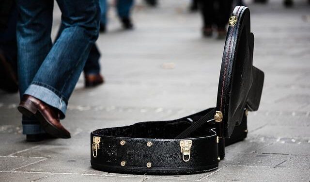 Russian street musician is jailed for 13 days after she played banned song – Reuters