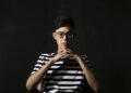 Chinese man, 19, lives under bridge with dog, works long hours to save for tuition – South China Morning Post