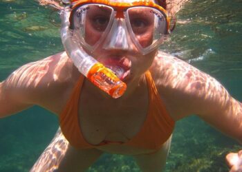 A South African politician goes snorkeling in a giant pothole to highlight city management failures – AP News