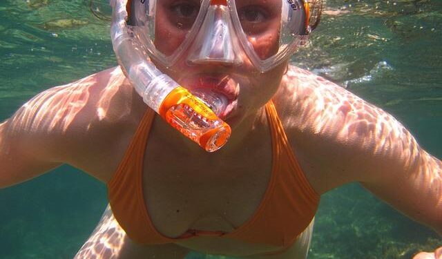 A South African politician goes snorkeling in a giant pothole to highlight city management failures – AP News